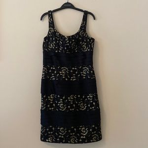 Black and gold cocktail dress with gold and mesh floral details